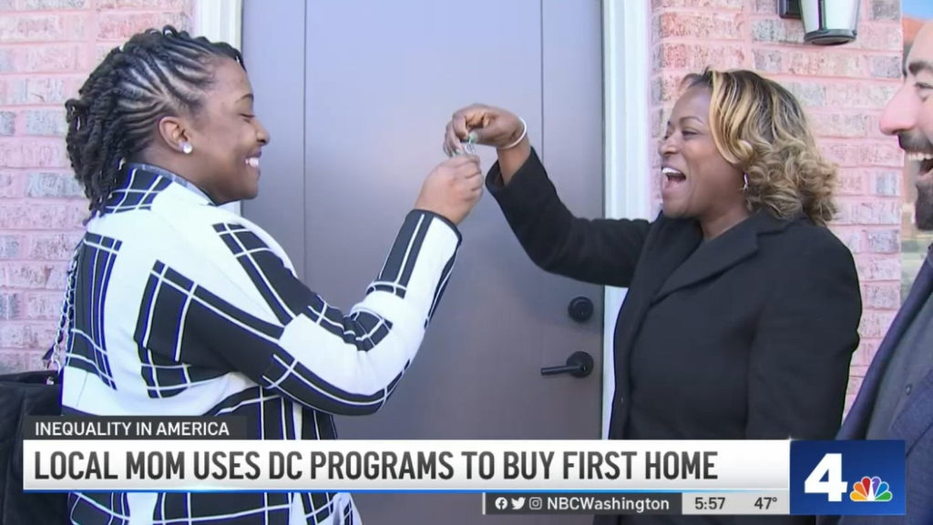 Brittany Freeman receives keys to her new home at District Towns in Congress Heights